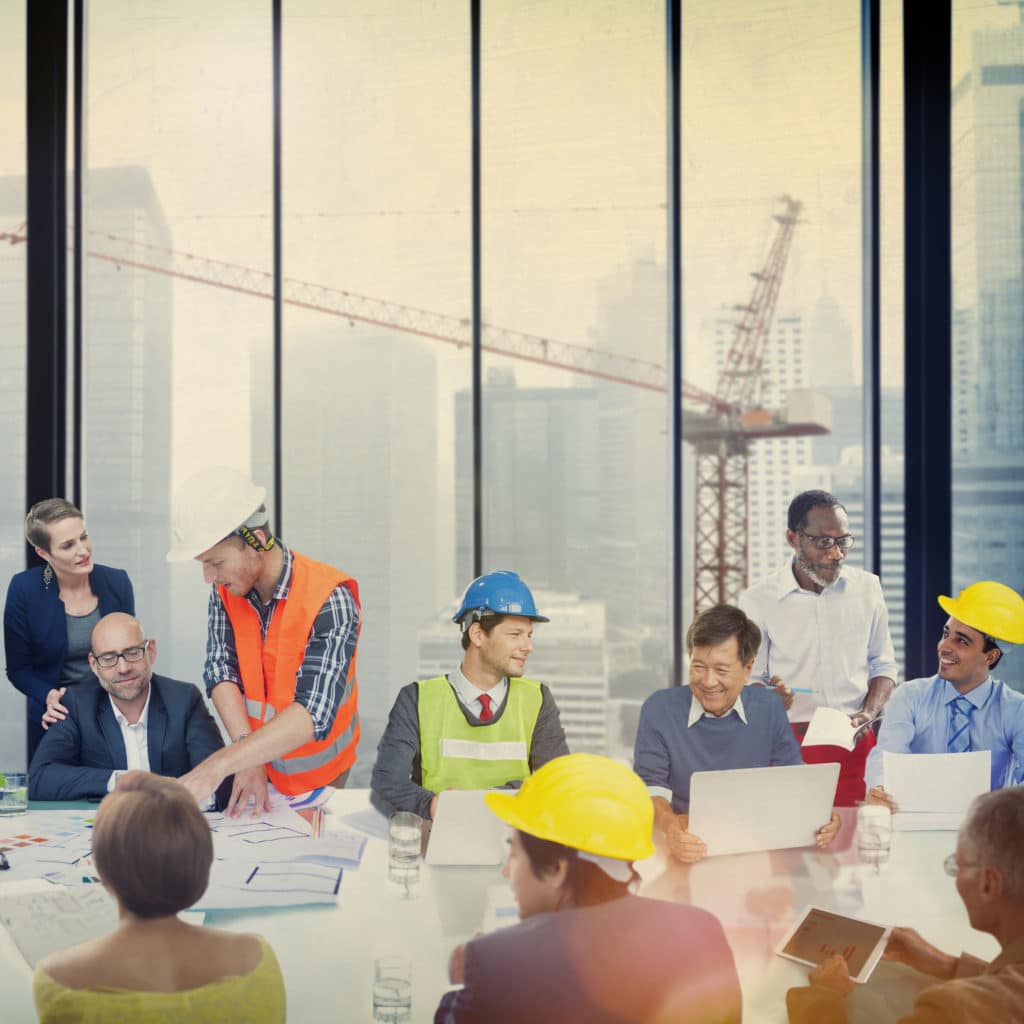 A group of construction project stakeholders at a meeting