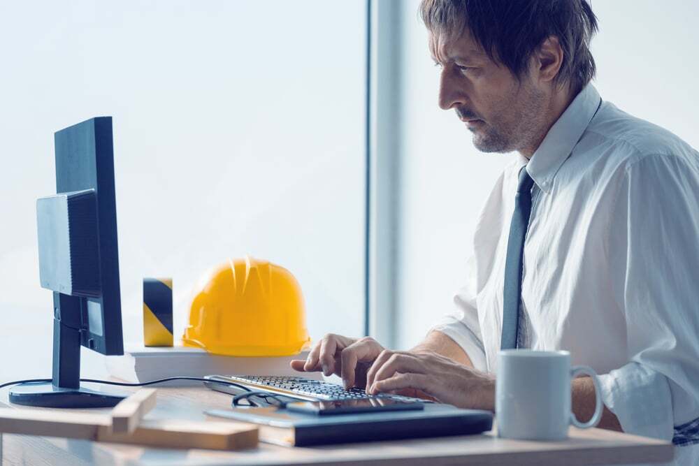 A construction worker working in an office