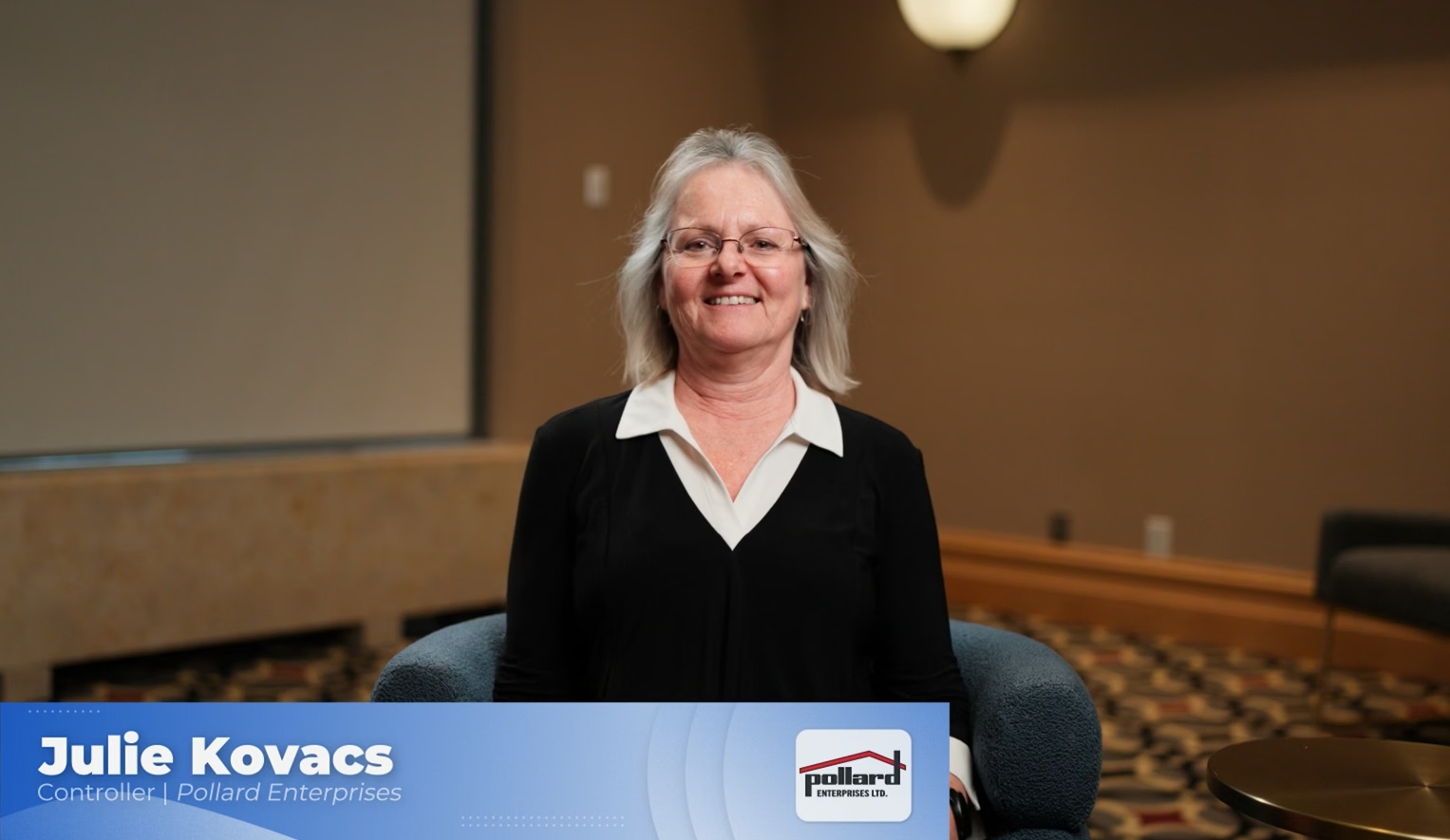 Julie Kovacs from Pollard Industries sitting in a chair doing an interview.