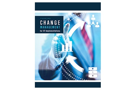 Alt text: "The book cover for 'Change Management for IT Implementations in Mechanical Contracting' featuring an image of digital arrows circling a blurred figure, dressed in a suit. This illustrates the concept of process and adaption within a corporate environment.