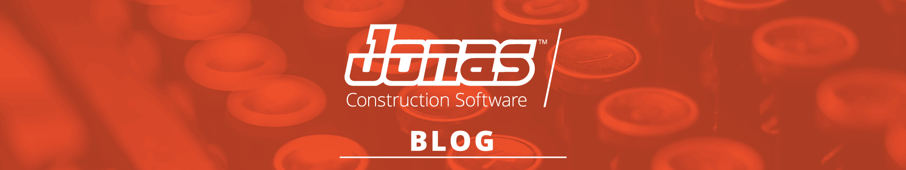 This image showcases the logo and text of "Jonas Construction Software Blog" positioned centrally against a blurry backdrop filled with orange safety helmets. The picture conveys a construction-related theme and points towards industry-specific content on the blog.