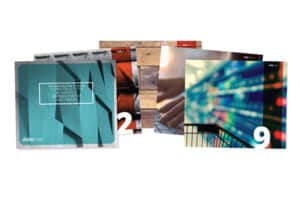 Array of brightly colored magazine covers with diverse themes showcasing facets of Jonas Construction Software, such as mechanical contracting, innovative technology, financial analytics and modern design elements.