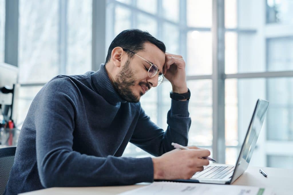 A frustrated accountant with a laptop