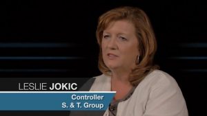 mechanical and specialty contracting. She is seated in an office environment, sharing insights on the effectiveness of Jonas Construction Software.

(Note: The interview content may give context for development of more specialized alt text)