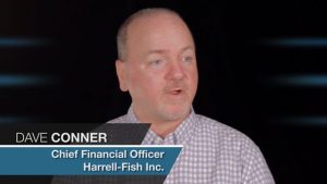 A middle-aged man named Dave Conner, who serves as a Chief Financial Officer at specialty contractors company Harrell-Fish Inc., is speaking against a dark background. He has light skin and a receding hairline.