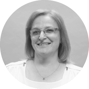 software, accounting, payroll, job project management, service management, operations analytics) are applicable to this image the alt text can be: 

"Portrait of a middle-aged woman with glasses.