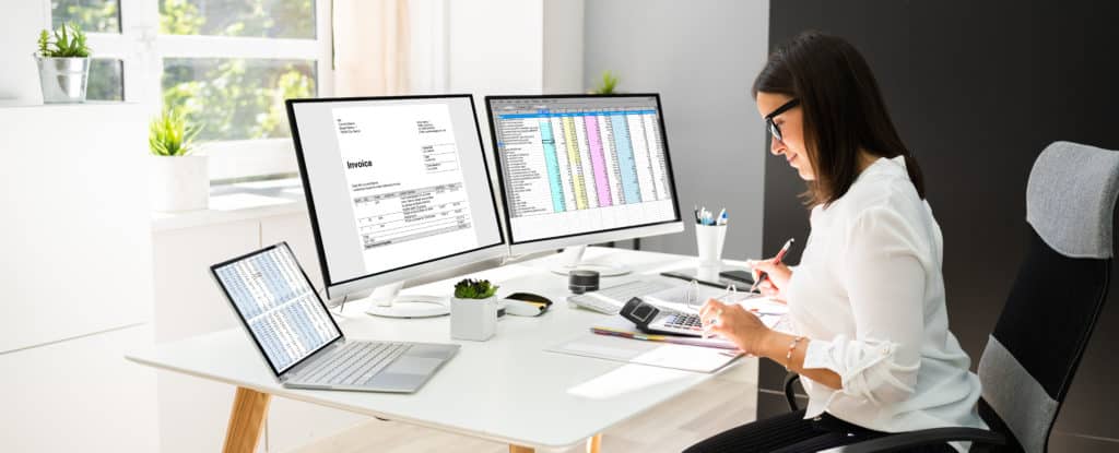 A woman doing a chart of accounts for construction company