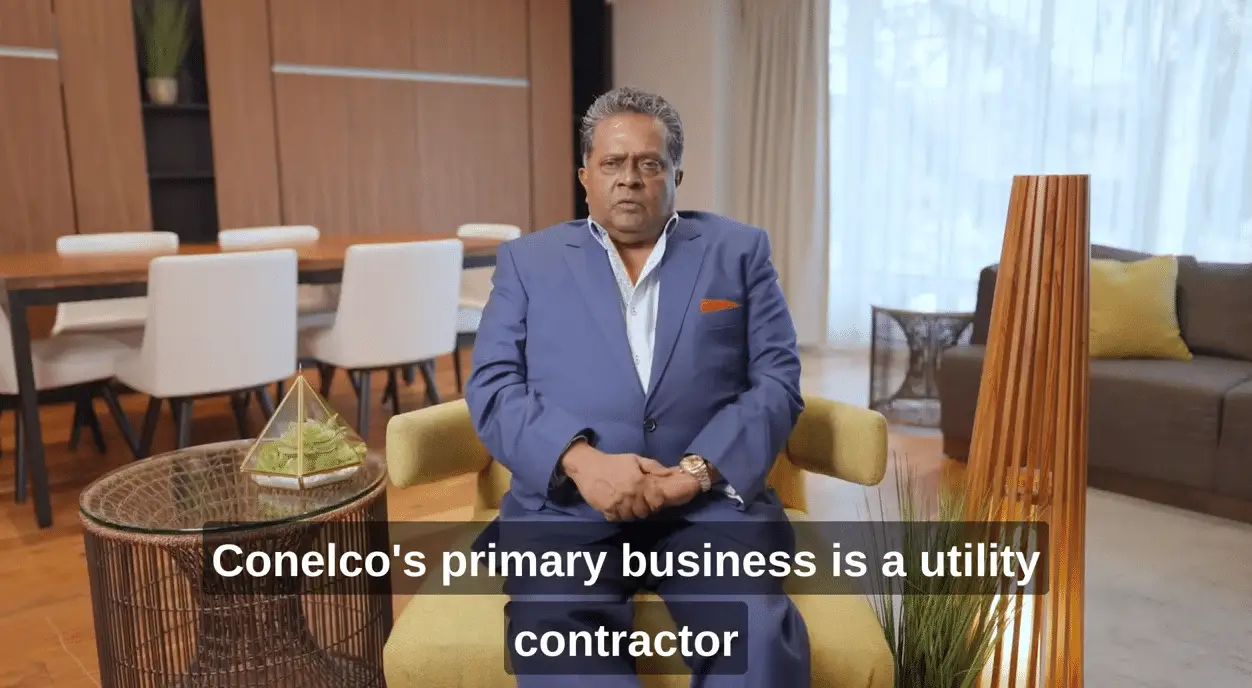 Middle-aged professional man sitting on a sofa in a modern office setting. Caption identifies him as part of Conelco, a company specializing in contractor services.